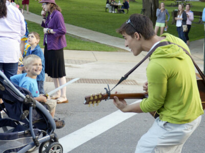 Summer open house kid with guitar and smiling kid