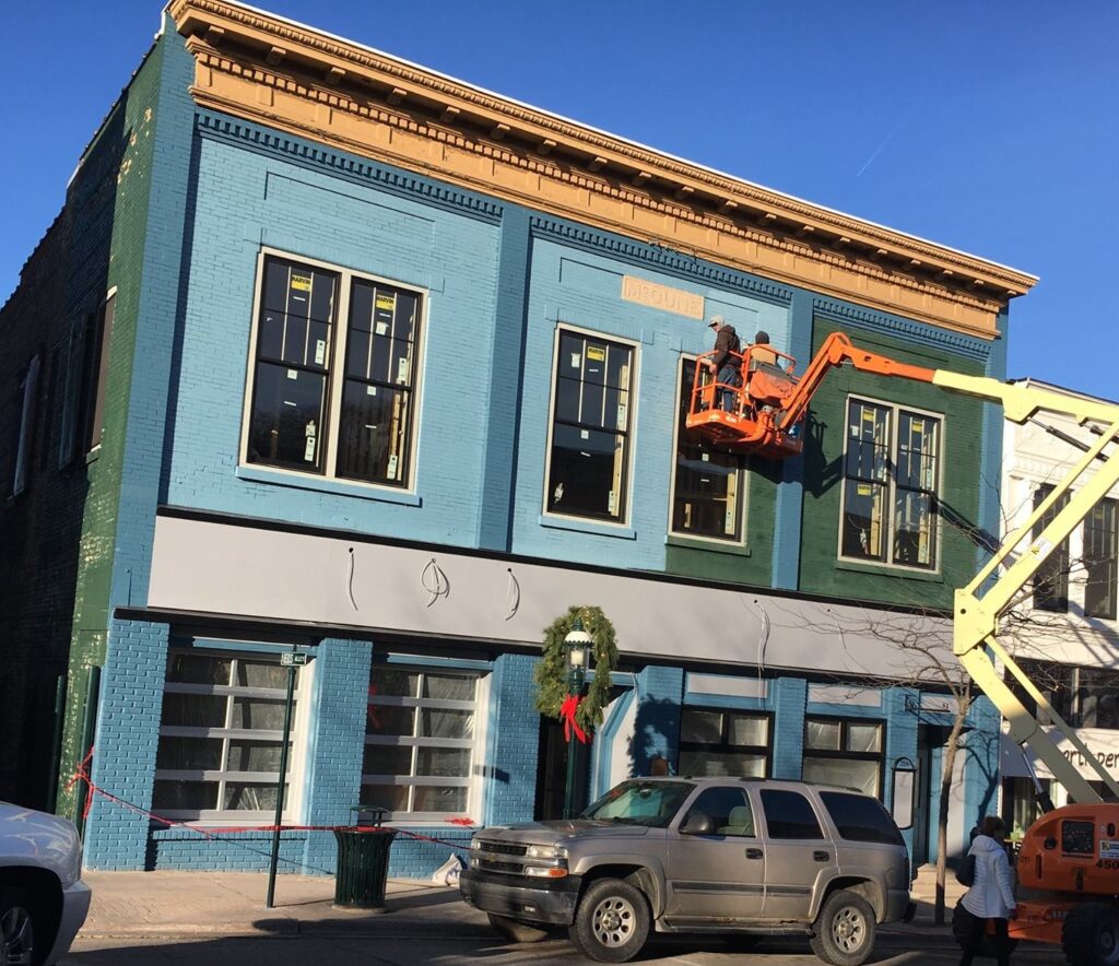 Painting the front of Gypsy Vodka building